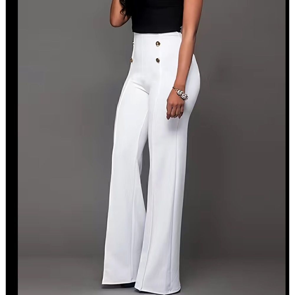 White high-waisted elastic waist with deco buttons pants.Loose leg .